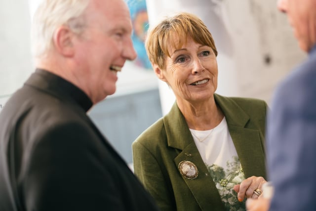 Anne Gibson, sister of Bishop Edward Daly, chats to Bishop Donal McKeown and other guests at Wednesday's exhibition launch.