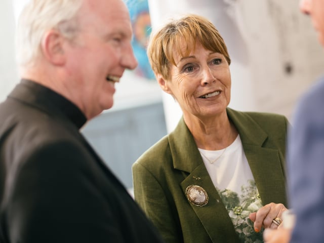 Anne Gibson, sister of Bishop Edward Daly, chats to Bishop Donal McKeown and other guests at Wednesday's exhibition launch.