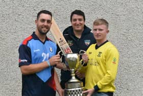 Newbuildings captain Jared Wilson (left) and Aaron Heywood Fox Lodge skipper holding the Sports Hub NW Senior Cup ahead of this weekend's final. Also pictured Peter McCartney, NWCU General Manager. Picture by Lawrence Moore