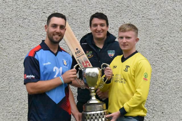 Newbuildings captain Jared Wilson (left) and Aaron Heywood Fox Lodge skipper holding the Sports Hub NW Senior Cup ahead of this weekend's final. Also pictured Peter McCartney, NWCU General Manager. Picture by Lawrence Moore