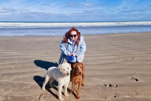 Emma Curran with her dogs Conan (left), who is Derry's Nose of Tralee and Conan's brother Teddy.