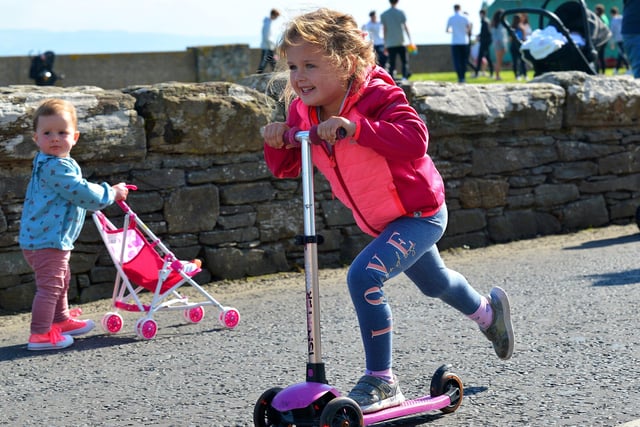 A Dash to the finish line in the Pedal Powered Tractor Run and Doll Push race at the Greencastle Regatta on Friday afternoon last. Photo: George Sweeney.  DER2231GS – 076