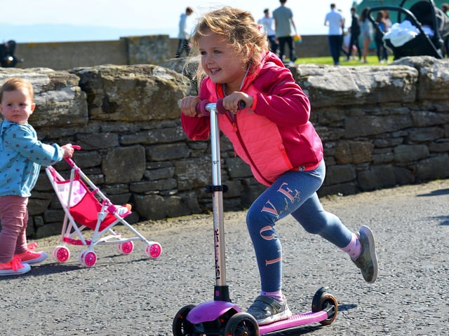 A Dash to the finish line in the Pedal Powered Tractor Run and Doll Push race at the Greencastle Regatta on Friday afternoon last. Photo: George Sweeney.  DER2231GS – 076