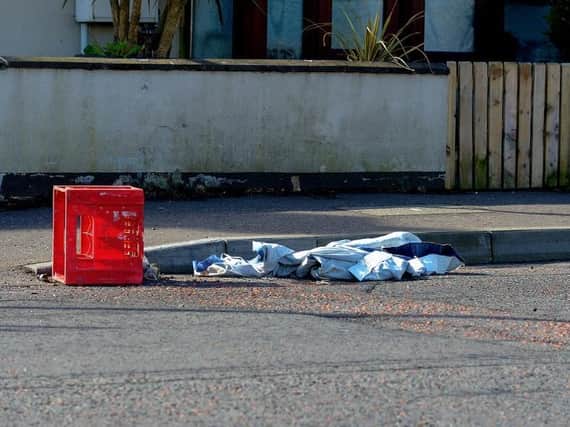 Items of clothing and a crate discarded at the Dungiven Road entrance to Irish Street where violence erupted on  Friday and Sunday evening last. DER2114GS – 003