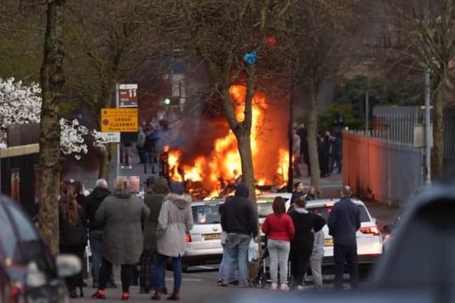 A bus burning during street disturbances in the Shankill Road area of Belfast.