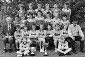 Mr Sean Friel, pictured left, with a colleague and past pupils, is fondly remembered by all who knew him.