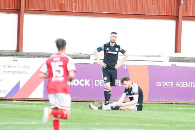 Danny Lafferty and Cameron McJannet react after Darragh Burns puts St Pat's 2-0 ahead. Photography by Kevin Moore.
