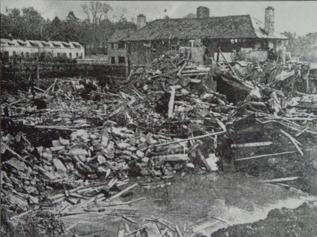 Bomb damage caused by a Luftwaffe parachute mine at Messines Park on April 15, 1941.