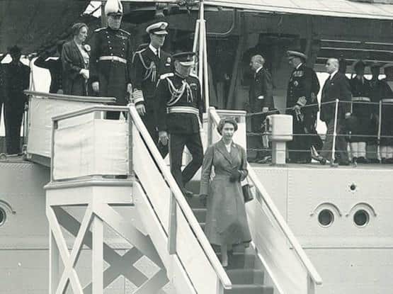 Elizabeth II of Great Britain and Northern Ireland disembarking at Lisahally with Prince Philip and other notables in 1953.