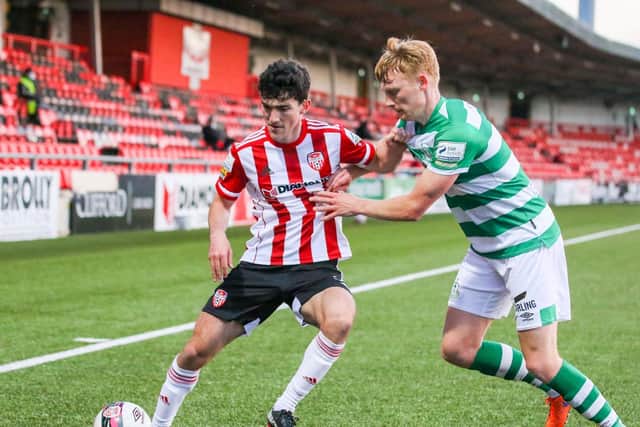 Brendan Barr holds off the challenge of Liam Scales during the defeat to Shamrock Rovers. Picture by Kevin Moore