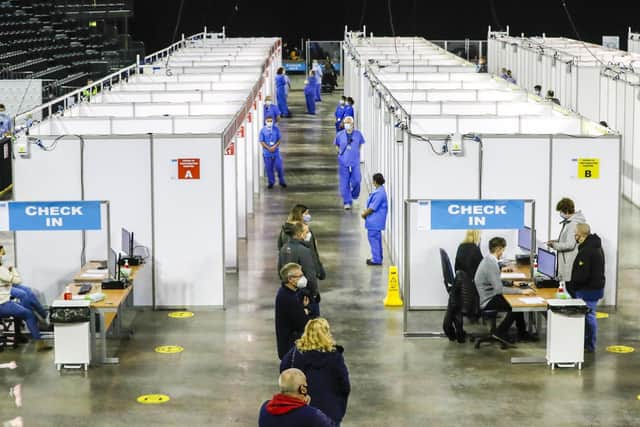 People queue for the first and sometimes second dose of Covid-19 vaccine in the SSE Arena in Belfast.