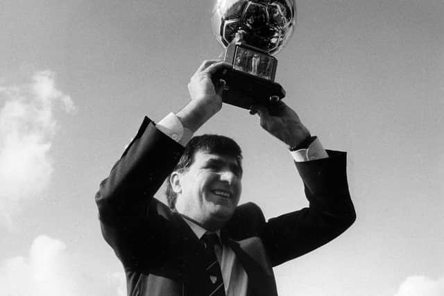 Derry City manager Jim McLaughlin celebrates winning the League Cup, in the first part of the club's domestic treble in 1989.