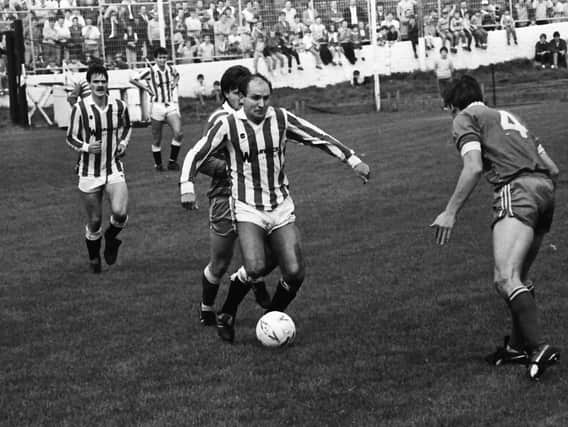 Former Sunderland and Manchester City winger Dennis Tueart in action in Derry City's first game in the League of Ireland against Home Farm, at a packed Brandywell way back in 1985.