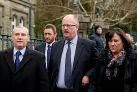MARCH 2017... Sir George Hamilton (centre) pictured at the funeral of Martin McGuinness at Long Tower Church in Derry.