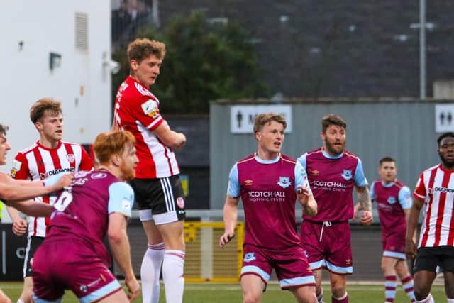 Derry City defender Ronan Boyce heads the home side level just before half time with his first senior goal. (Picture by Kevin Moore).