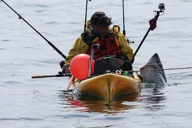 Kayak angler Graham Smith from Moville with a Porbeagle on a previous expedition. (Picture by Martin Moloney)