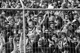 Derry City fans pack into the Brandywell Stadium to watch their hometown team play its first game in the League of Ireland against Home Farm in September 1985.