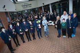 Mrs Katrina Crilly (Principal) presenting Lee’s mum Jacqueline Gurney with Lee's Oakgrove Leavers Hoodie at Oakgrove Integrated College on Monday. Included are sixth form students and members of staff. On right also are Lee’s dad Derek, brothers Jay and Cain, and family friend Melanie Toland. (Photos: Jim McCafferty Photography)