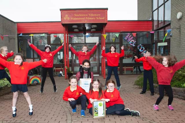 Miss Bronagh Lynch pictured with some of the pupils from Steelstown PS celebrate their achievement in the FairAware School awards this week. Kneeling, front centre are Aoife Lynch, Niah Barnfield and Maya O'Doherty. Standing from left are Hannah O'Neill, Niaya McCafferty, Ava McGill, Andrew O'Doherty, Lola Foy (Eco Committee President), Braeden Rush (Eco Committee Vice President) and Elsa Kehoe.
