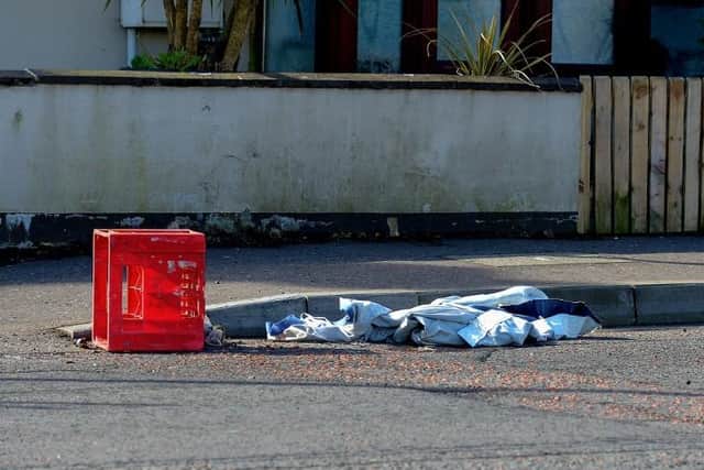 A discarded crate that was used to carry petrol bombs in Irish Street recently.