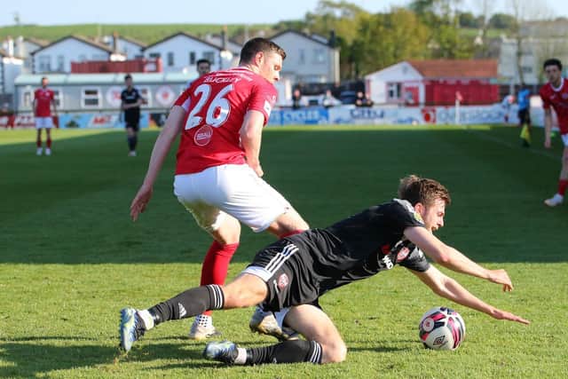 Garry Buckley brings Will Patching down during Saturday's game at the Showgrounds.