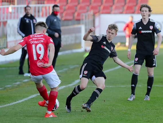 Derry City midfielder Ciaron Harkin charges down this attempted clearance by Sligo defender Regan Donelon. Picture by Kevin Moore.