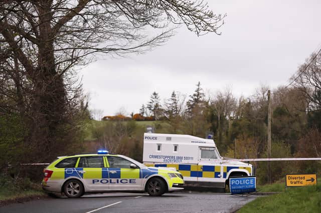 PSNI at the scene where a viable explosive device was left at the home of a female police officer near Dungiven.