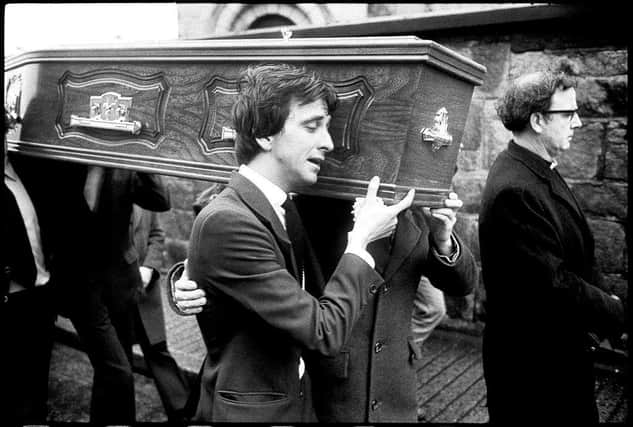 Paul Whitters’ coffin is carried into St Columba’s Church, Long Tower.