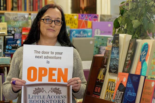 Jenni Doherty preparing for the reopening of her Little Acorns Bookstore, on Foyle Street, this morning as lockdown restrictions on non-essential retail outlets are lifted. Photo: George Sweeney.  DER2117GS - 004