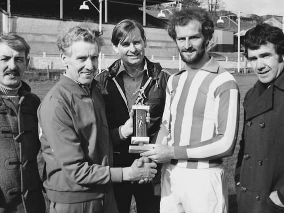 The late, great Terry Kelly, captain, Derry City FC, making a presentation on behalf of the club to trainer Dan Watson in recognition of his services to the Brandywell outfit.