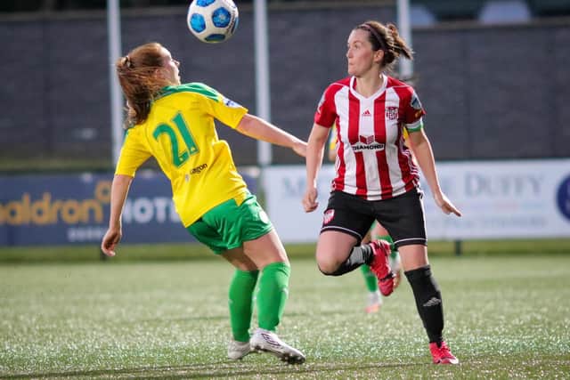 Derry City Women's Naomi McMullan skips away from Cliftonville Ladies Chloe Orr during their league opener at Brandywell. Picture by John Paul McGinley/JPJPhotography