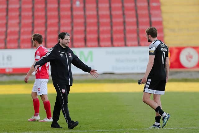 Derry boss Ruaidhri Higgins embraces matchwinner Will Patching at the final whistle in Sligo.
