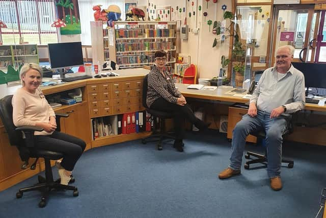 John pictured alongside Julie Harkin and Deirdre McCarron.