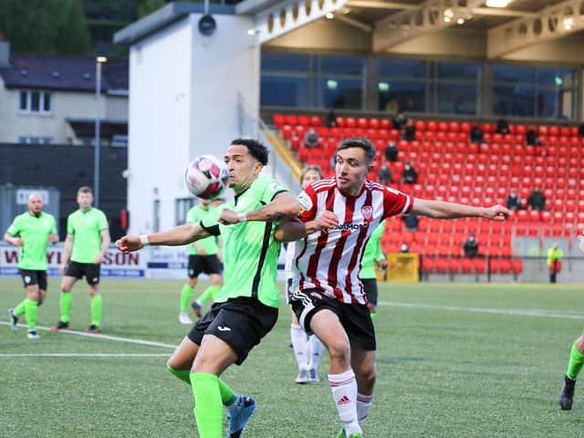 Derry City midfielder Joe Thomson and Will Seymore (Finn Harps) battle for the ball during the derby. Photograph by Kevin Moore.