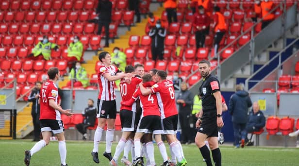 Derry City celebrate James Akintunde's opening strike in the derby. Photograph by Kevin Moore.