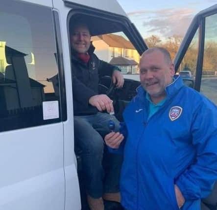 Stan Falconer handing over the keys to the minibus to Jason Hughes from NICC.