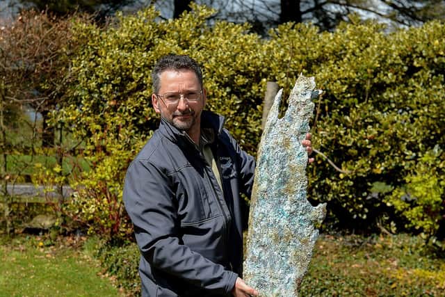 Jonny McNee holds a part of a propeller, recovered from the WWII Bristol Beaufort twin-engine torpedo bomber crash site at Ballykelly. DER2118GS – 002