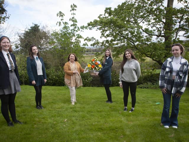 Georgia Donnelly presenting flowers to Sandra Biddle, Foyle School of Speech and Drama awards last week. Included from left are Eildh Oâ€TMConnor Abby O'Donnell, Aimee Doherty and Leah Curry. (Photos Jim McCafferty Photography)