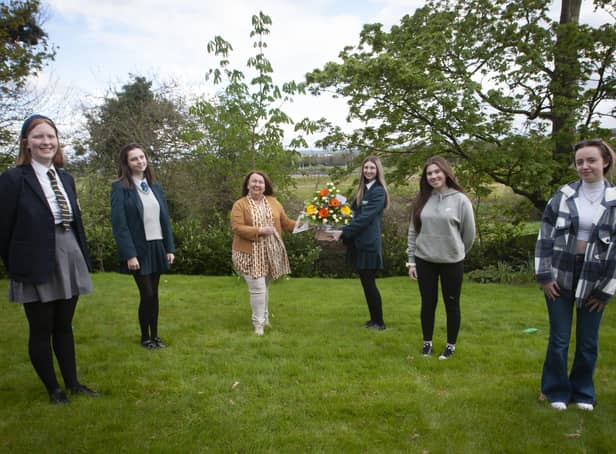 Georgia Donnelly presenting flowers to Sandra Biddle, Foyle School of Speech and Drama awards last week. Included from left are Eildh Oâ€TMConnor Abby O'Donnell, Aimee Doherty and Leah Curry. (Photos Jim McCafferty Photography)