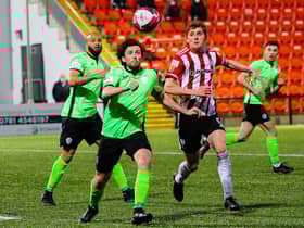 Finn Harps midfielder Barry McNamee keeps his eye on the ball as Derry City’s Ronan Boyce prepares to tackle during Monday night’s derby. Picture by Kevin Moore/MCI