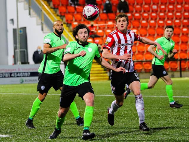 Finn Harps midfielder Barry McNamee keeps his eye on the ball as Derry City’s Ronan Boyce prepares to tackle during Monday night’s derby. Picture by Kevin Moore/MCI