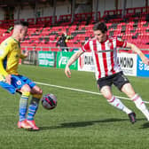 Derry City defender Ciaran Coll attempts to get past Longford's Dylan Grimes at the Ryan McBride Brandywell Stadium. Picture by Kevin Moore.