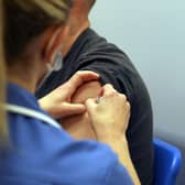 A member of the public receives an injection of the Moderna Covid-19 vaccine