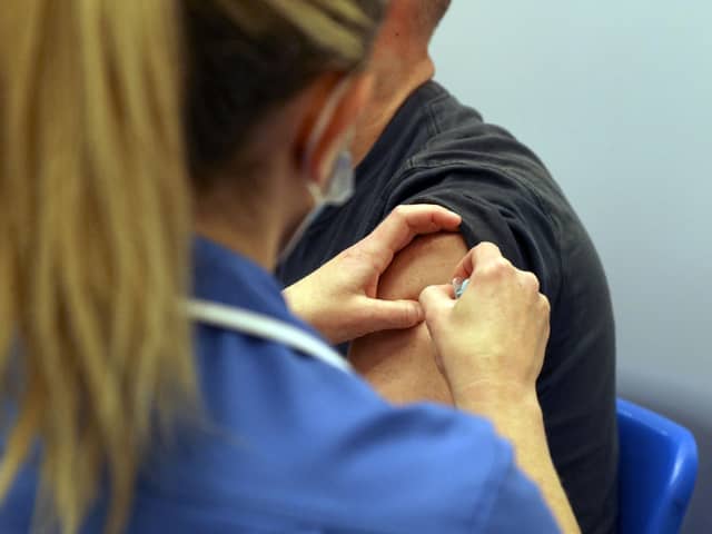 A member of the public receives an injection of the Moderna Covid-19 vaccine