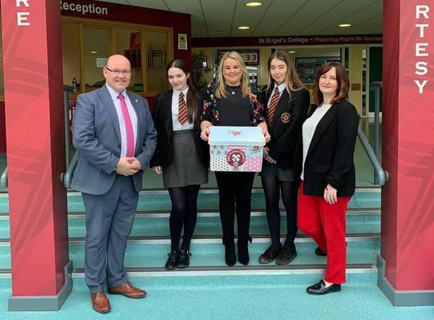 2019: Councillor Sandra Duffy with Mr McMonagle, Miss McCauley and pupils from St Brigids College delivering free period products.