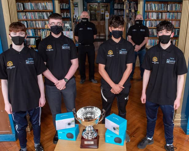 Lumen Christi College students Aodhan Gillespie, Kiernan Nash,  Marco Logue and Luca Dunlop, who were the winners of the NWRC Engineering Challenge pictured with John Cartin, NWRC Deputy Head of Training and Skills and Philip Devlin, Manager NWRCâ€TMs PDC. (pic Martin McKeown).