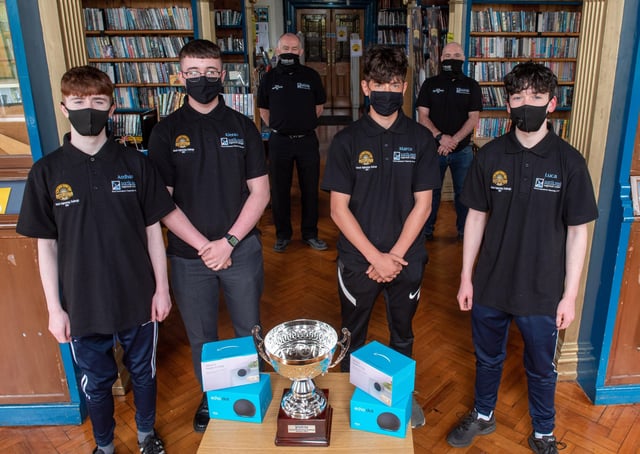 Lumen Christi College students Aodhan Gillespie, Kiernan Nash, Marco Logue and Luca Dunlop, who were the winners of the NWRC Engineering Challenge pictured with John Cartin, NWRC Deputy Head of Training and Skills and Philip Devlin, Manager NWRCâ€TMs PDC. (pic Martin McKeown).