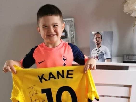 Five-year-old Spurs fan Caleb Toland with a signed shirt he received from Spurs and England player Harry Kane earlier this week.
