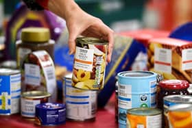 London, UK. 21 November, 2019. Donations are made at the launch of the Tesco Food Collection in the Surrey Quays Extra store.