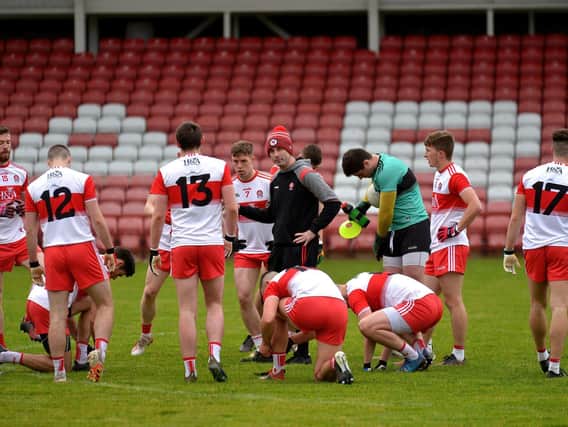 Derry manager Rory Gallagher talks to his players during last year's Division Three encounter against Longford in Celtic Park.